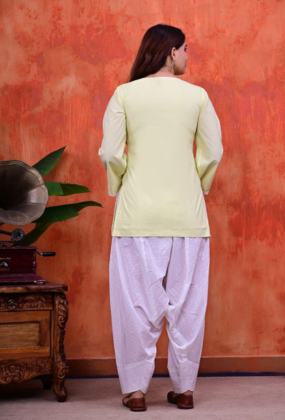 Women Plain Lime Cotton Short Kurti with Flared Sleeves Paired with  White Patiala Salwar