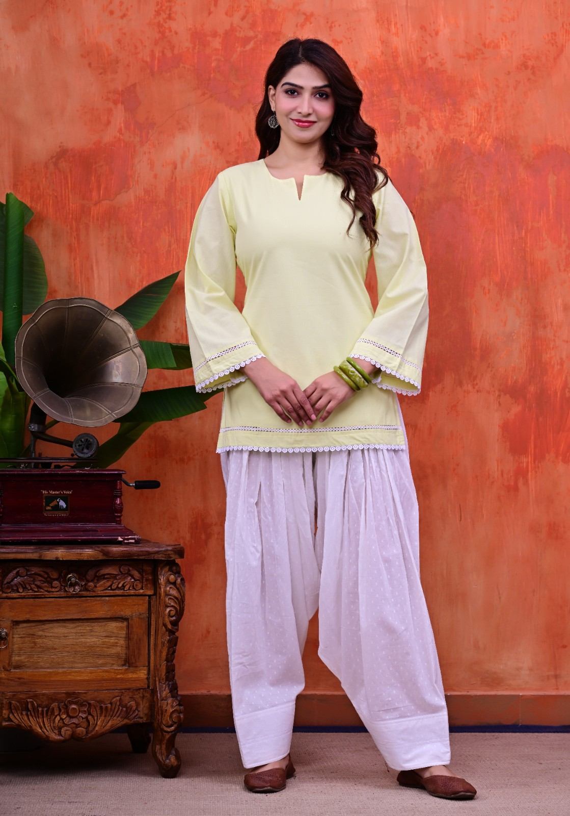 Women Plain Lime Cotton Short Kurti with Flared Sleeves Paired with  White Patiala Salwar