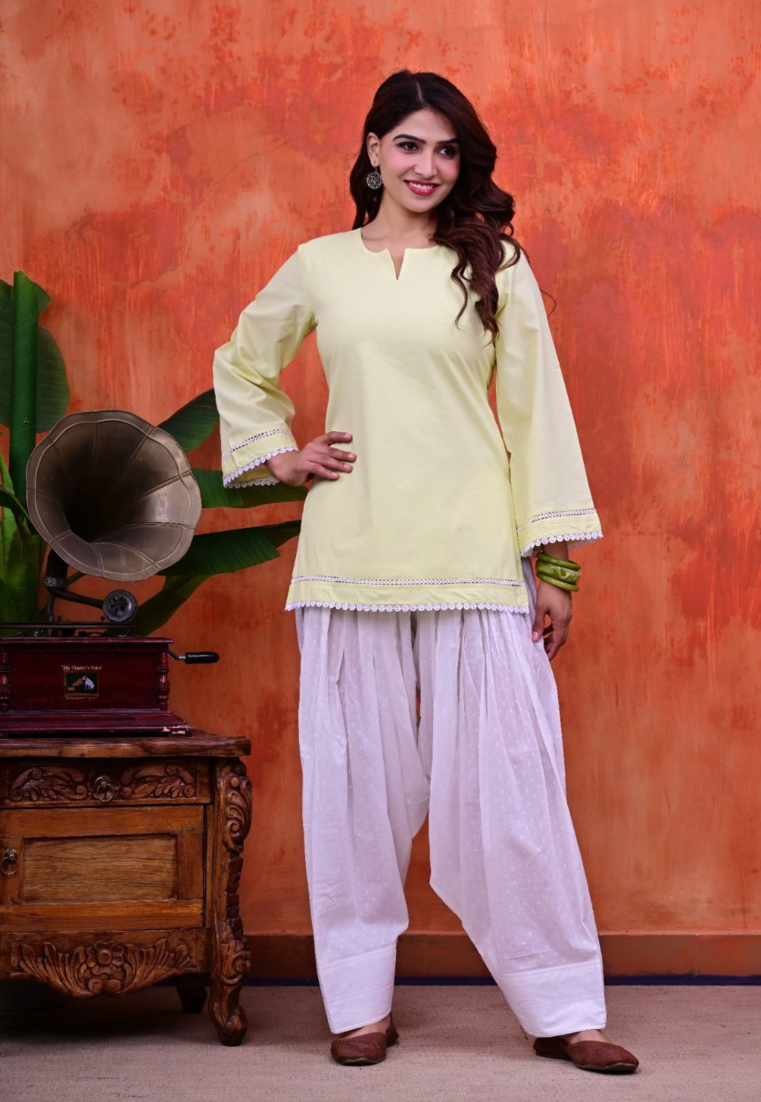 Women Plain Lime Cotton Short Kurti with Flared Sleeves Paired with  White Patiala Salwar