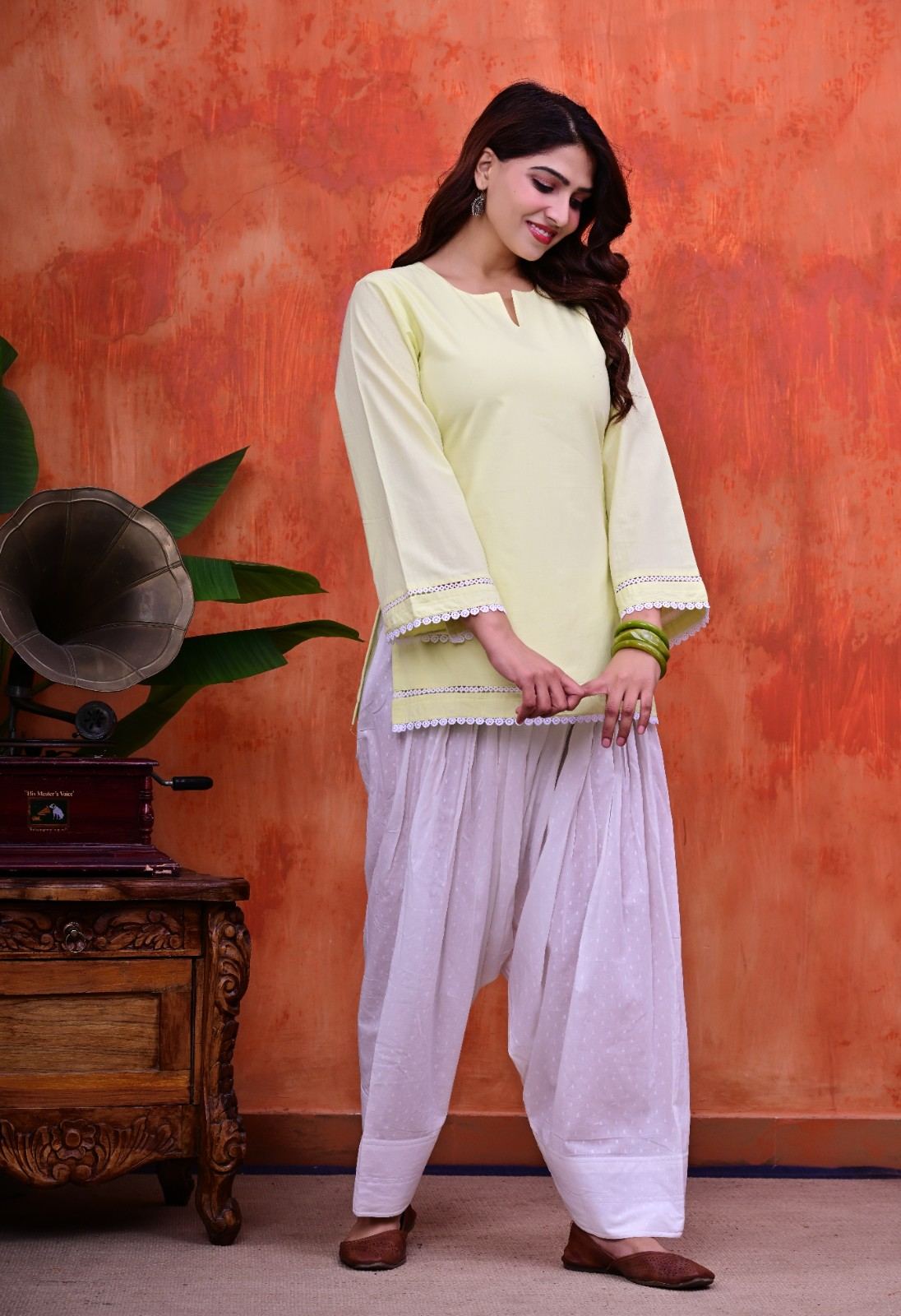 Women Plain Lime Cotton Short Kurti with Flared Sleeves Paired with  White Patiala Salwar