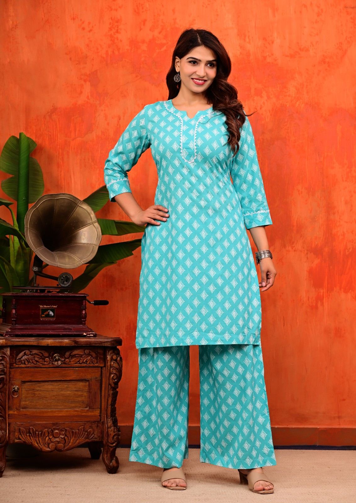 Turquoise Blue Pure Cotton Printed Kurti and Flared Palazzo Suit