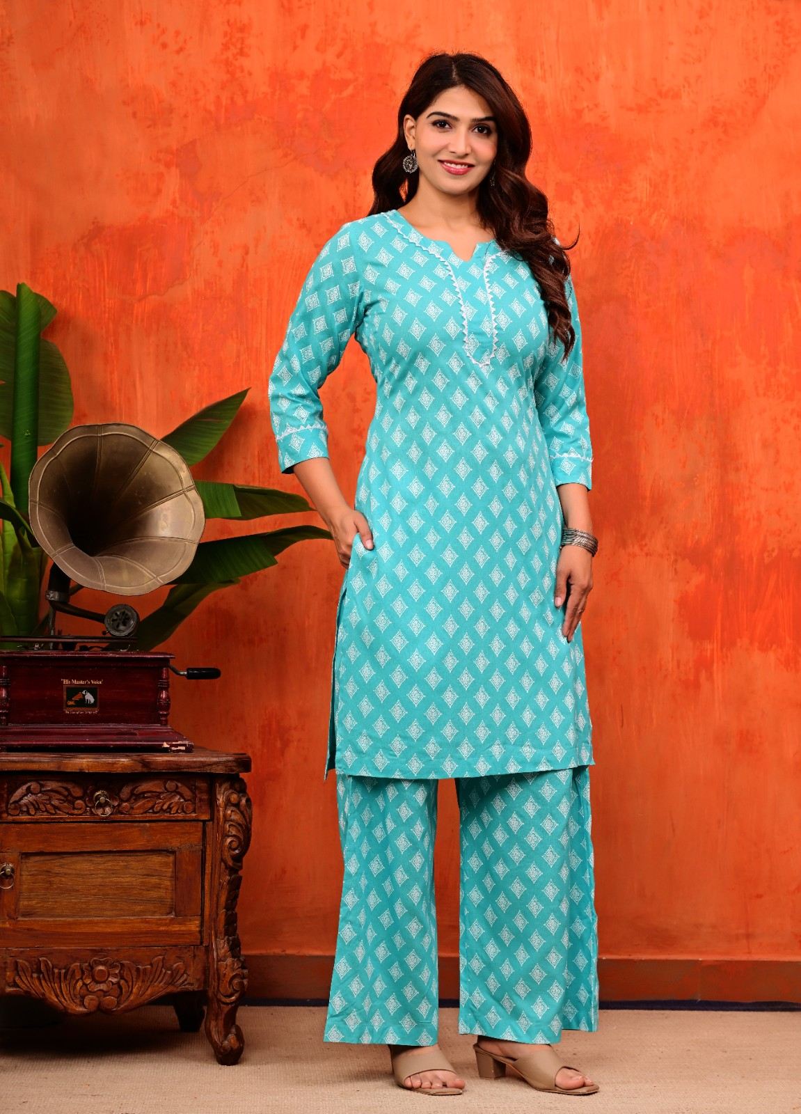 Turquoise Blue Pure Cotton Printed Kurti and Flared Palazzo Suit